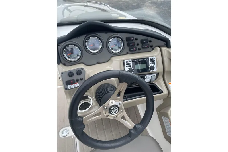 Slide: The Image of Steering console of 2014 Yamaha Boats 242 Limited with gauges and controls. - 15