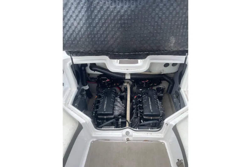 Slide: The Image of Engine compartment of a 2014 Yamaha Boats 242 Limited, showcasing dual engines. - 17