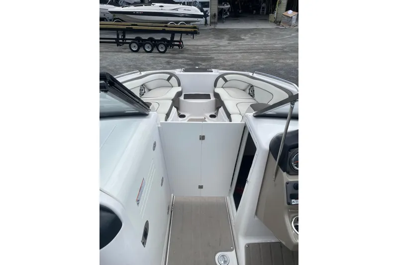 Slide: The Image of 2014 Yamaha Boats 242 Limited interior with seating and dashboard view. - 18
