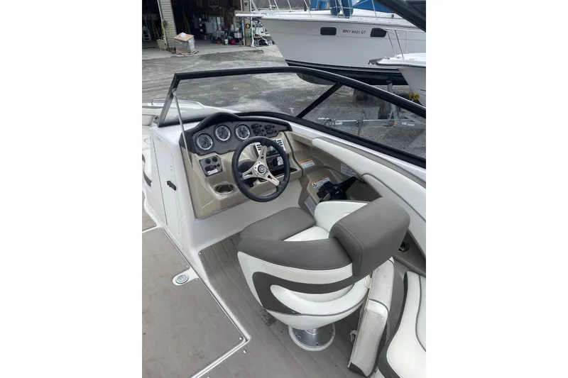 Slide: The Image of 2014 Yamaha Boats 242 Limited cockpit with steering wheel and gauges. - 7