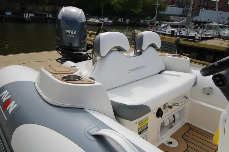 Slide: The Image of 2018 Avon Seasport 400 Deluxe NEO boat with 50hp Yamaha engine docked by the water. - 11
