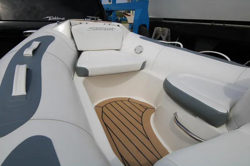 Slide: The Image of 2018 Avon Seasport 400 Deluxe NEO boat interior with cushioned seating and teak flooring. - 7