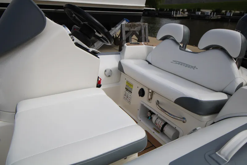 Slide: The Image of 2018 Avon Seasport 400 Deluxe NEO boat interior with white seating and steering wheel. - 9