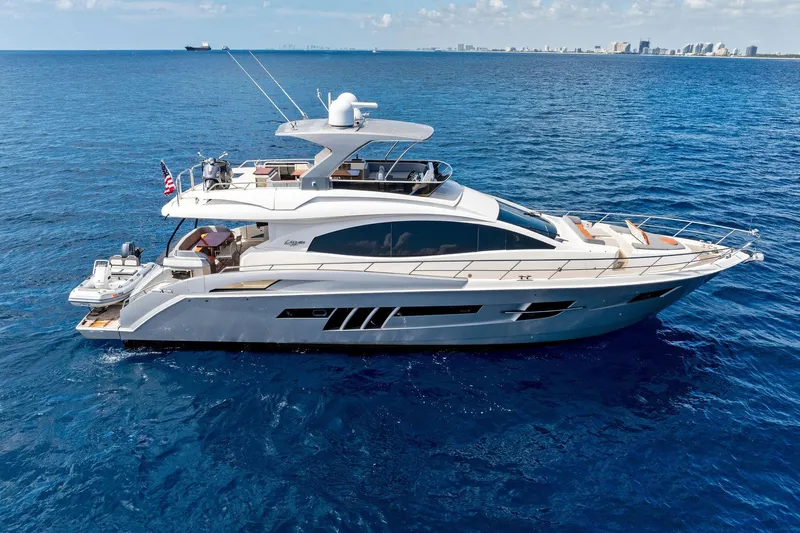The Image of Luxury 2014 Lazzara 64 yacht cruising on open blue ocean waters. - 0