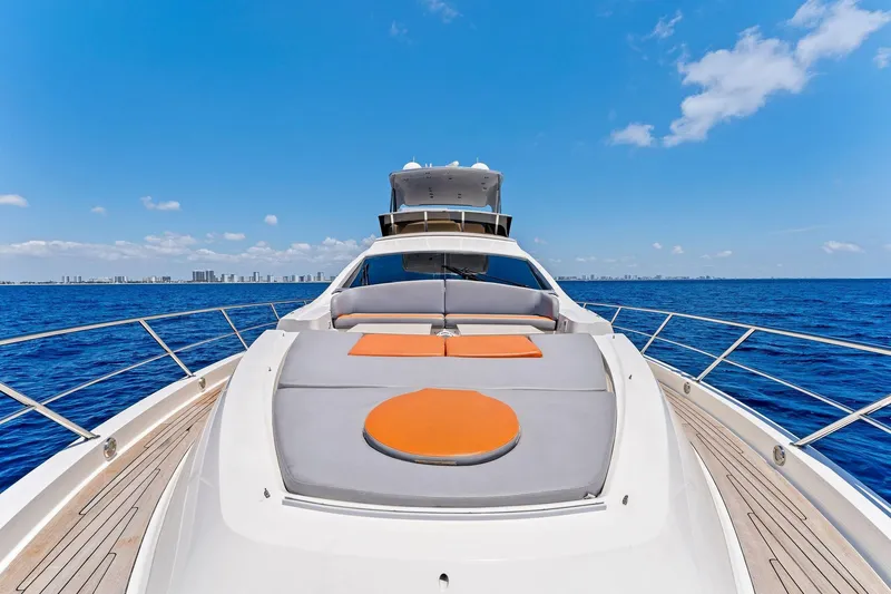 Slide: The Image of Luxurious 2014 Lazzara 64 yacht on open sea with sunbathing deck. - 16