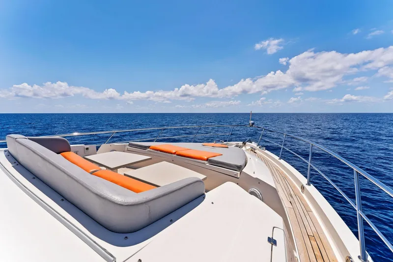 Slide: The Image of Luxurious 2014 Lazzara 64 yacht deck with sun loungers, overlooking the ocean. - 21