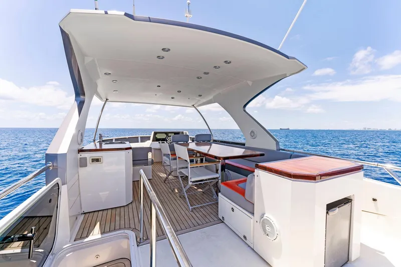Slide: The Image of Luxurious 2014 Lazzara 64 yacht deck with seating, ocean view, and modern design. - 24
