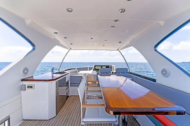 Slide: The Image of Luxurious 2014 Lazzara 64 yacht deck with elegant seating and ocean view. - 26