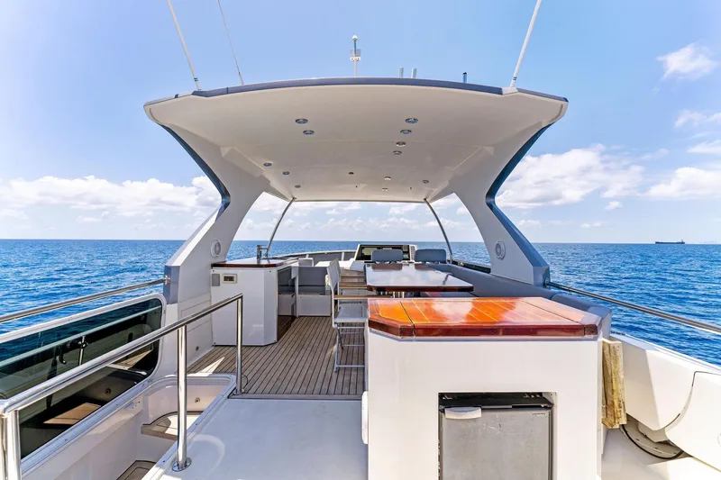 Slide: The Image of Luxurious 2014 Lazzara 64 yacht deck with ocean view and modern amenities. - 28