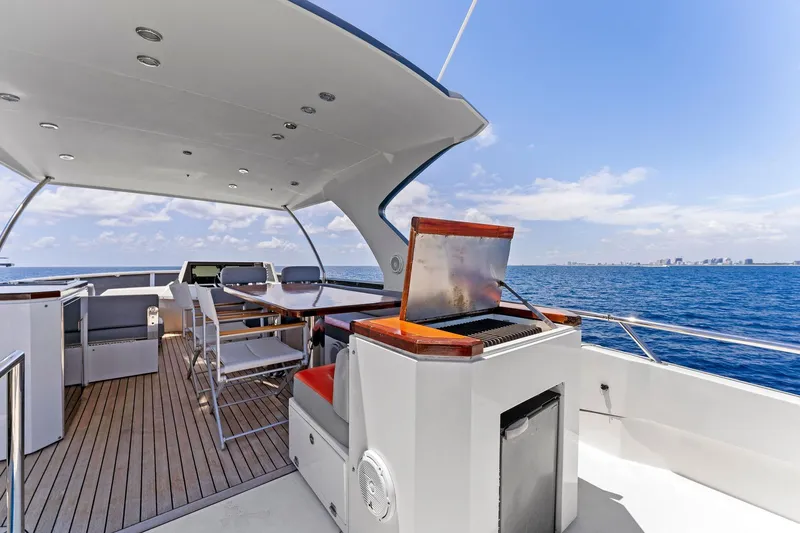 Slide: The Image of Luxurious 2014 Lazzara 64 yacht deck with seating and ocean view. - 30
