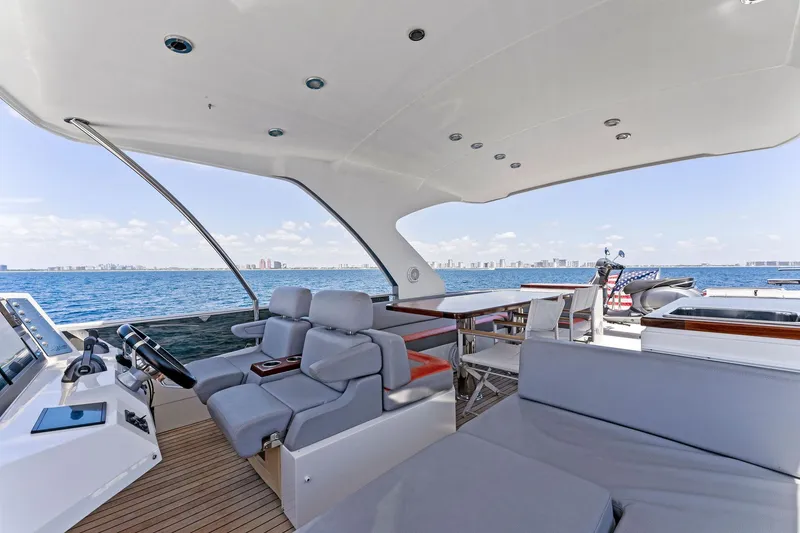 Slide: The Image of Luxurious 2014 Lazzara 64 yacht interior with ocean view and modern seating. - 32