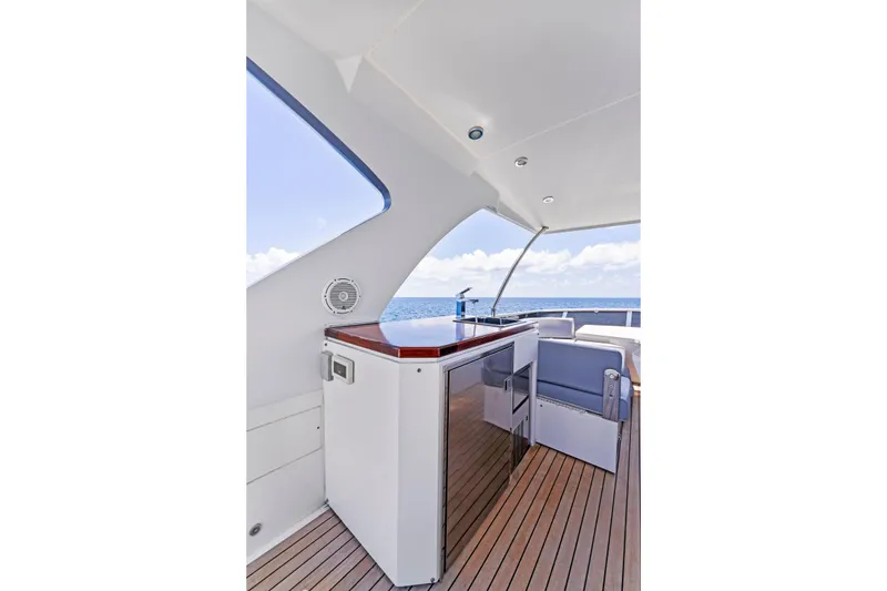 Slide: The Image of Luxurious 2014 Lazzara 64 yacht interior with sleek design and ocean view. - 34