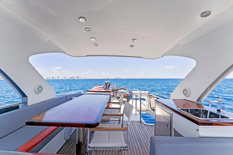 Slide: The Image of Luxurious 2014 Lazzara 64 yacht deck with ocean view and modern seating area. - 35