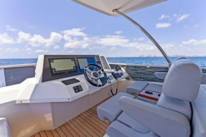 Slide: The Image of Luxurious 2014 Lazzara 64 yacht helm with ocean view and modern navigation equipment. - 37
