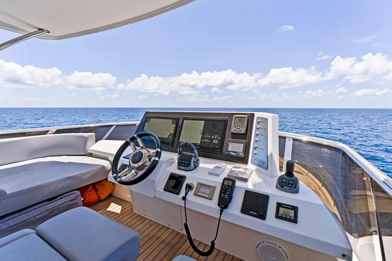 Slide: The Image of Luxurious 2014 Lazzara 64 yacht helm with ocean view and modern navigation equipment. - 39