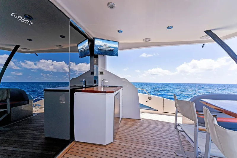 Slide: The Image of Luxurious 2014 Lazzara 64 yacht deck with ocean view and modern amenities. - 45