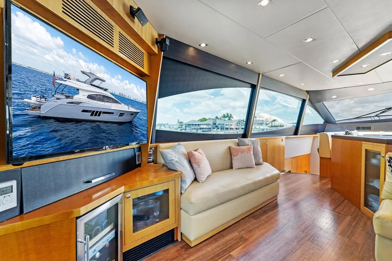 Slide: The Image of Luxurious interior of a 2014 Lazzara 64 yacht with modern furnishings and large windows. - 50