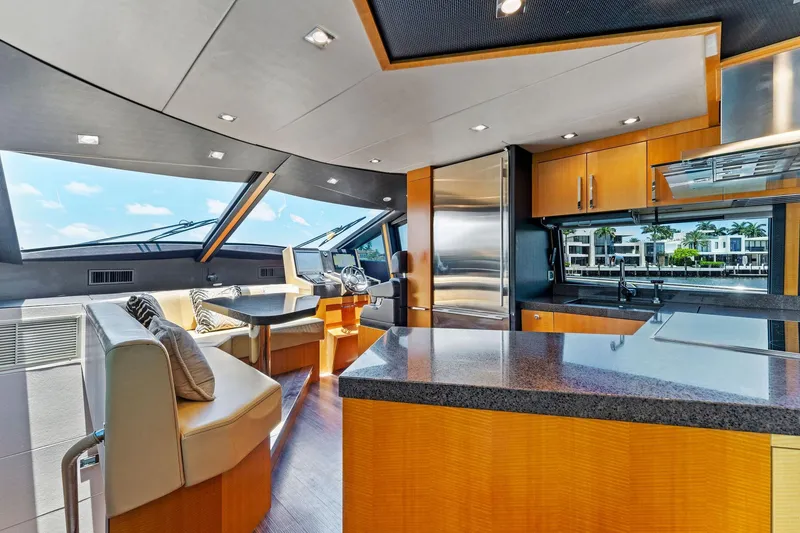 Slide: The Image of Luxurious interior of a 2014 Lazzara 64 yacht with modern kitchen and seating area. - 54