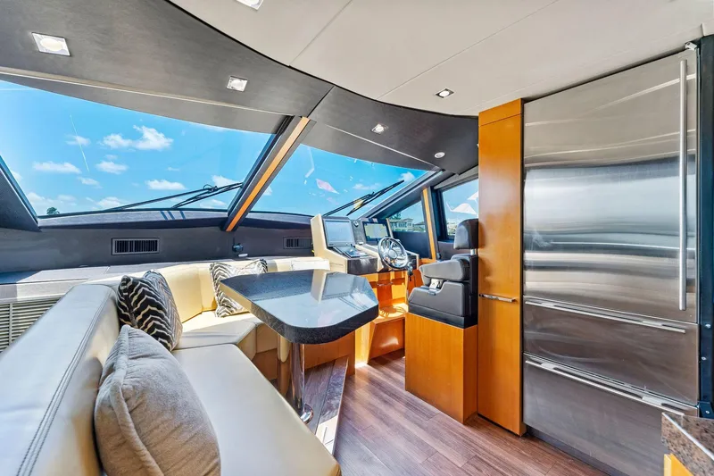 Slide: The Image of Luxurious interior of 2014 Lazzara 64 yacht with modern seating and helm. - 55