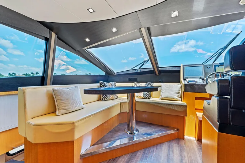 Slide: The Image of Luxurious interior of 2014 Lazzara 64 yacht with plush seating and panoramic windows. - 58