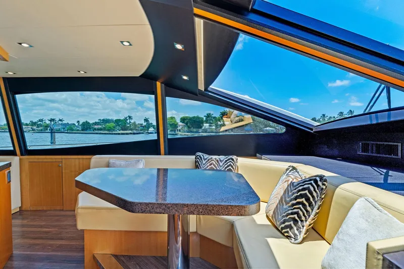 Slide: The Image of Luxurious interior of 2014 Lazzara 64 yacht with panoramic windows and elegant seating. - 61