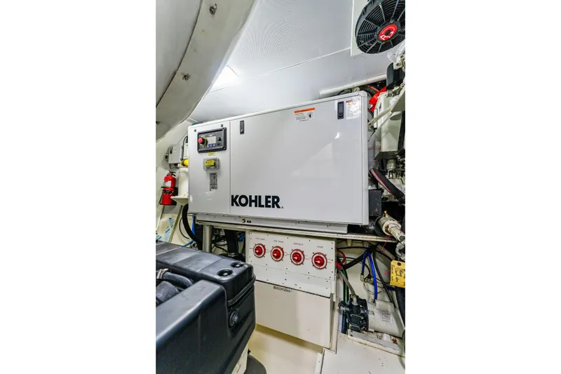 Slide: The Image of Engine room of 2014 Lazzara 64 yacht featuring Kohler generator. - 67
