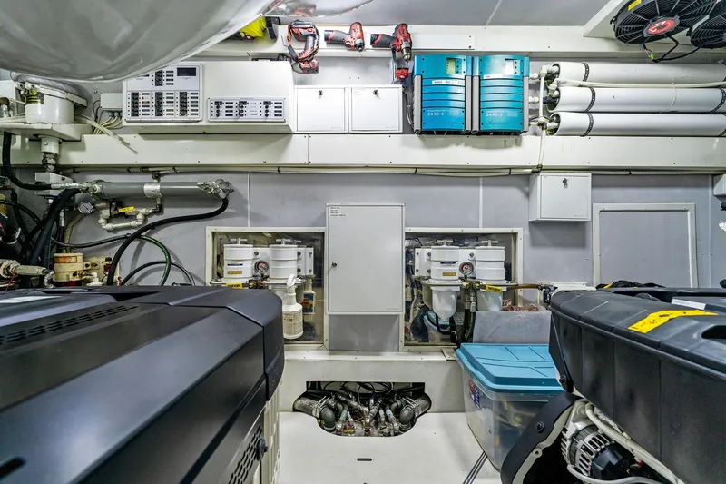 Slide: The Image of Engine room of a 2014 Lazzara 64 yacht, showcasing equipment and storage. - 68