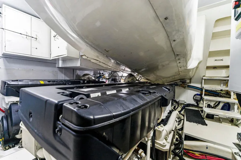 Slide: The Image of Engine room of a 2014 Lazzara 64 yacht, showcasing machinery and equipment. - 69