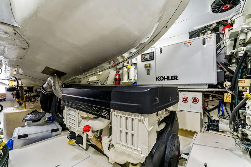 Slide: The Image of Engine room of a 2014 Lazzara 64 yacht featuring a Kohler generator. - 71