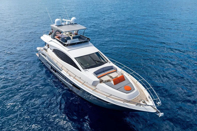 Slide: The Image of Luxurious 2014 Lazzara 64 yacht cruising on open blue sea. - 75