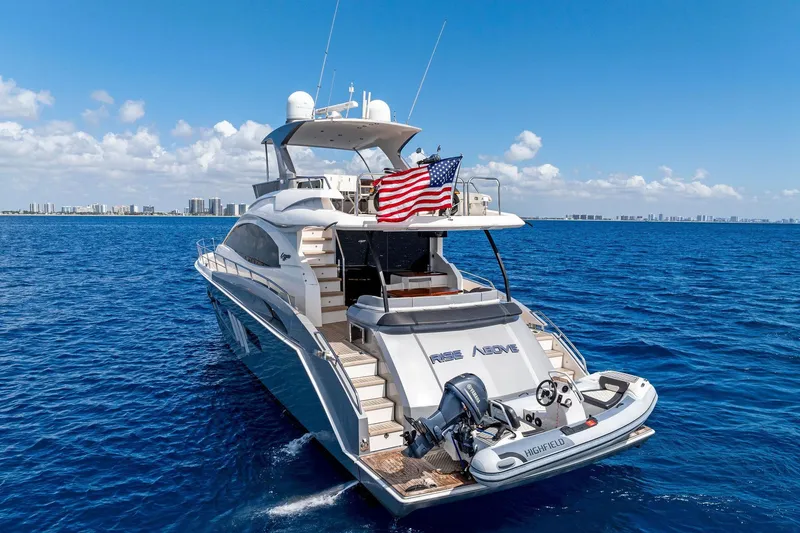 Slide: The Image of Luxury 2014 Lazzara 64 yacht cruising on open blue ocean under clear skies. - 79