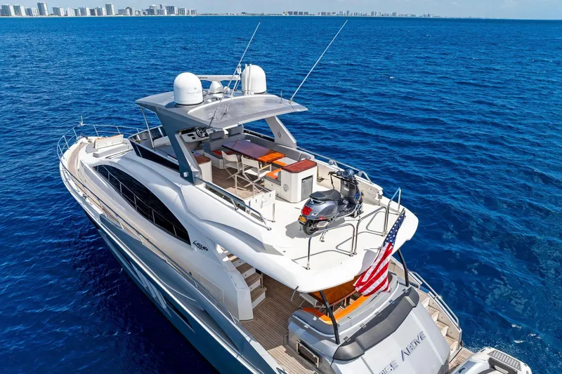 Slide: The Image of Luxury 2014 Lazzara 64 yacht cruising on blue ocean near city skyline. - 81