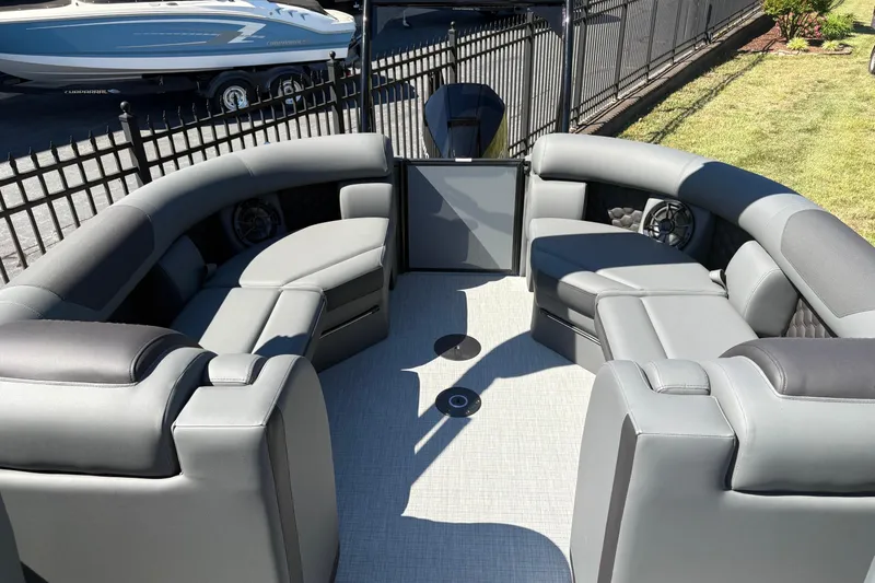 Slide: The Image of 2026 South Bay 525RS pontoon boat with luxurious gray seating and modern design. - 4