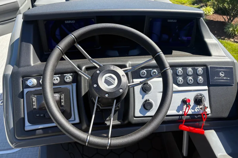 Slide: The Image of Steering console of 2026 South Bay 525RS boat with controls and dashboard. - 8