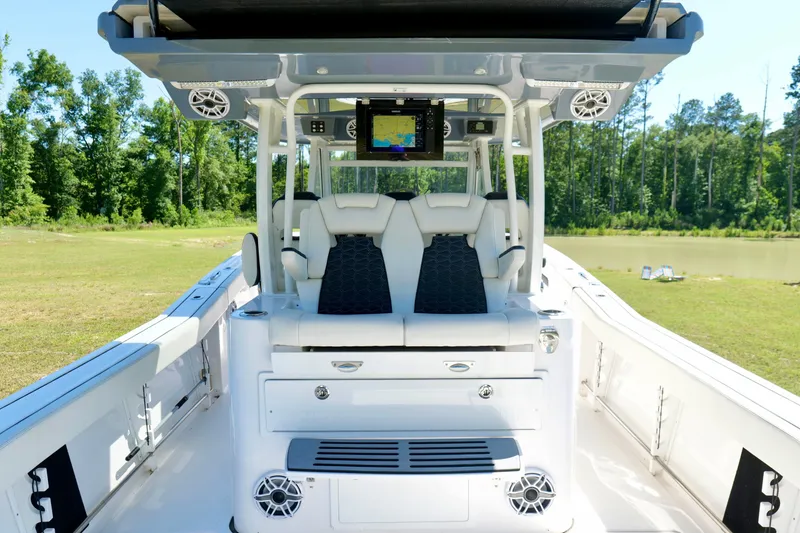 Slide: The Image of 2024 Tidewater 380 CC Adventure boat interior with modern seating and navigation system. - 22