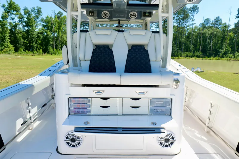 Slide: The Image of 2024 Tidewater 380 CC Adventure boat interior with seating and storage compartments. - 25