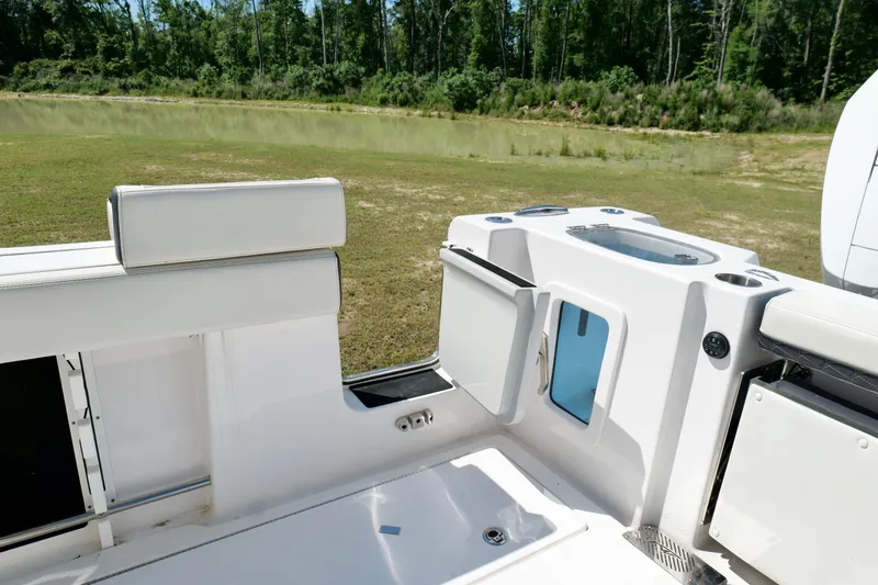 Slide: The Image of 2024 Tidewater 380 CC Adventure boat interior with seating and storage compartments. - 30