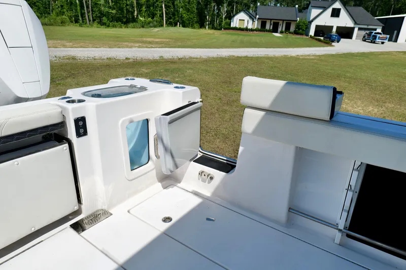 Slide: The Image of 2024 Tidewater 380 CC Adventure boat interior with seating and storage compartments. - 31