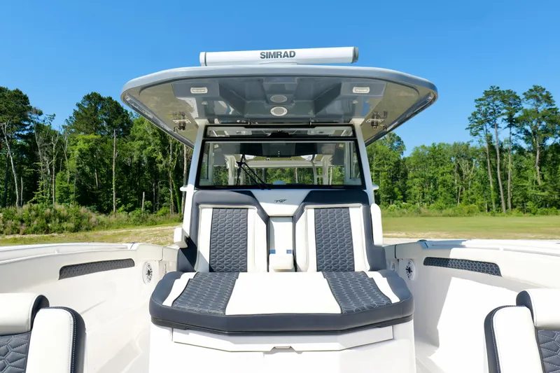 Slide: The Image of 2024 Tidewater 380 CC Adventure boat with sleek seating and advanced navigation system. - 36