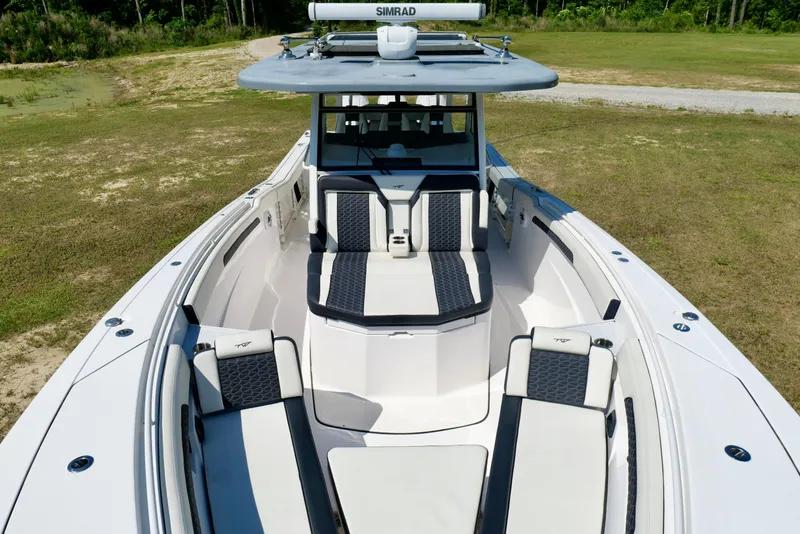 Slide: The Image of 2024 Tidewater 380 CC Adventure boat with spacious seating and modern design. - 38