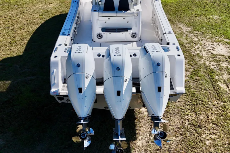 Slide: The Image of 2024 Tidewater 380 CC Adventure boat with triple outboard engines, viewed from above. - 5