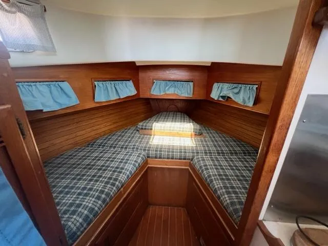 Slide: The Image of Interior of a 1989 Cape Dory Flybridge Cruiser with cozy sleeping area. - 11