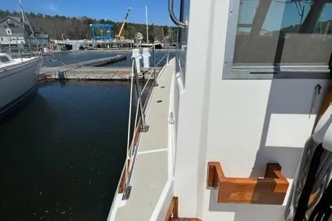Slide: The Image of 1989 Cape Dory Flybridge Cruiser docked, side view. - 16