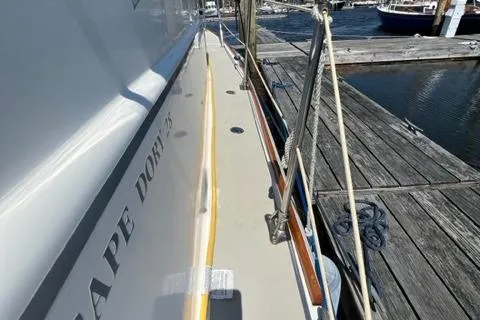 Slide: The Image of 1989 Cape Dory Flybridge Cruiser at dock, side view. - 17