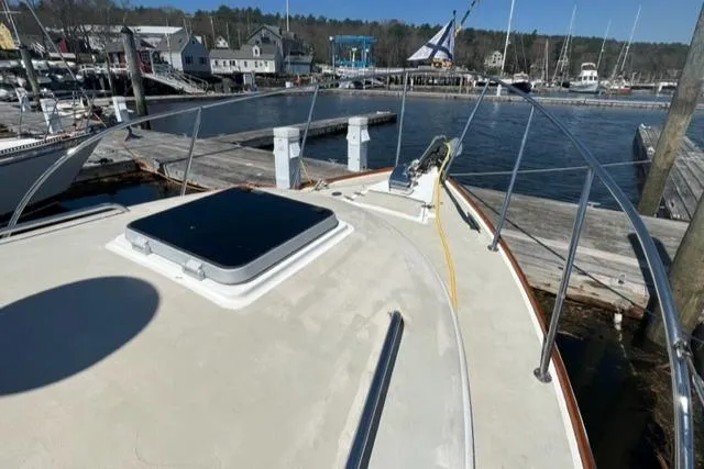 Slide: The Image of 1989 Cape Dory Flybridge Cruiser docked with harbor view. - 18