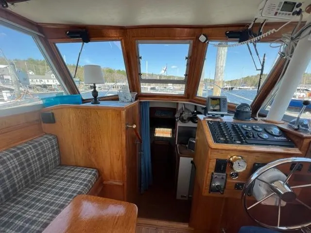 Slide: The Image of Interior of a 1989 Cape Dory Flybridge Cruiser with helm station. - 2