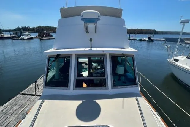 Slide: The Image of 1989 Cape Dory Flybridge Cruiser docked, front view. - 20
