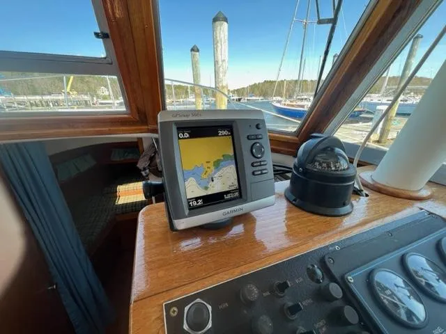 Slide: The Image of Interior view of a 1989 Cape Dory Flybridge Cruiser with navigation system. - 7