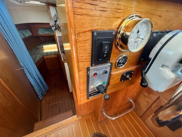 Slide: The Image of Interior of a 1989 Cape Dory Flybridge Cruiser with wood paneling. - 9
