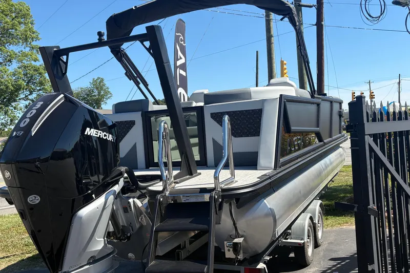 Slide: The Image of 2026 Alera 23Q pontoon boat with Mercury 300 V8 engine on trailer. - 1